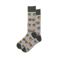 Pair of grey crew socks with a repeating pattern of retro sunglasses and palm trees at sunset. Orange, blue, and black design elements on a heather grey background.