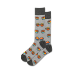 Pair of grey crew socks with a repeating pattern of retro sunglasses and palm trees at sunset. Orange, blue, and black design elements on a heather grey background.
