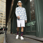 A full-body lifestyle shot of a man wearing a floral shirt and the navy blue poppy-print crew socks. The socks are partially visible. [lf]