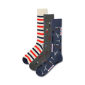 Three pairs of crew socks. One pair features red and white stripes, another has barber tools, and the third is navy with barber tools.