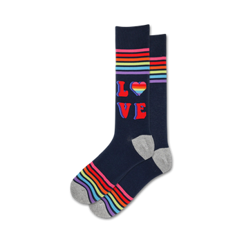 retro style dark blue crew socks with rainbow stripes and a heart in place of the "o" in "love" displaying a pride theme.   