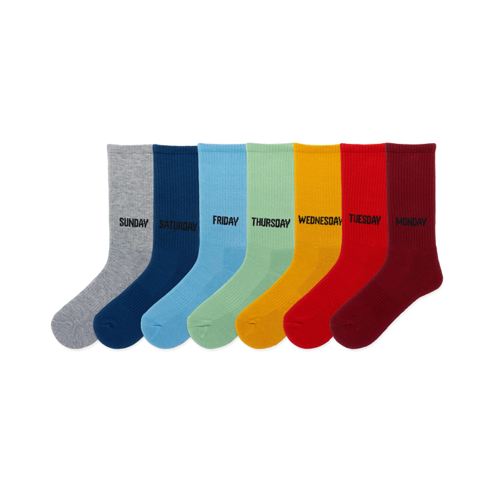 Seven crew socks in a rainbow of colors: gray, navy, light blue, light green, yellow, red, burgundy. Each sock has a day of the week printed on it. }}