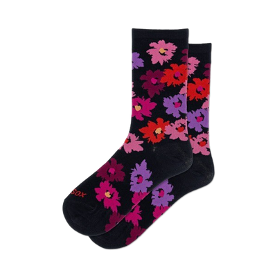 womens tropical floral crew socks with vibrant colors and playful patterns of various tropical flowers on a black background.  