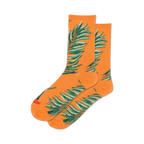 Pair of orange crew socks with teal palm leaf design. 