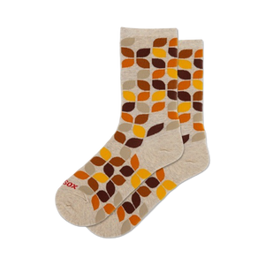 women's leafy geo crew socks: overlapping leaf pattern in brown, orange on beige background.   