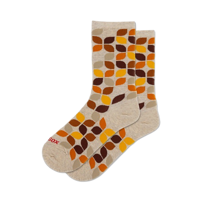 women's leafy geo crew socks: overlapping leaf pattern in brown, orange on beige background.   