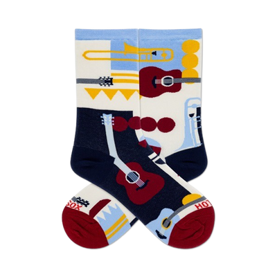 blue music retro womens crew socks feature bold funky guitar, trumpet, trombone, and saxophone pattern.   