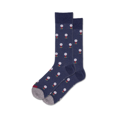 dark blue crew socks featuring white golf balls resting on a white tee.  