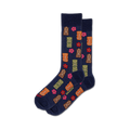 Pair of navy blue crew socks with a fun pattern of colorful tiki gods and pink hibiscus flowers.