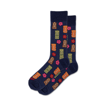 dark blue crew socks with cartoon tikis and hibiscus flowers in orange, yellow, green, and pink.   
