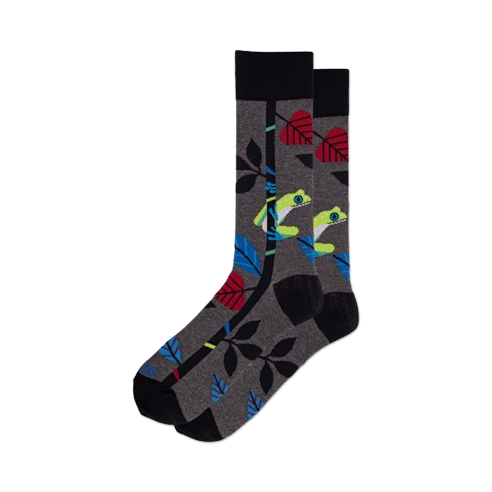 mens crew socks with colorful tree frog, leaves, vine pattern on dark gray background. 