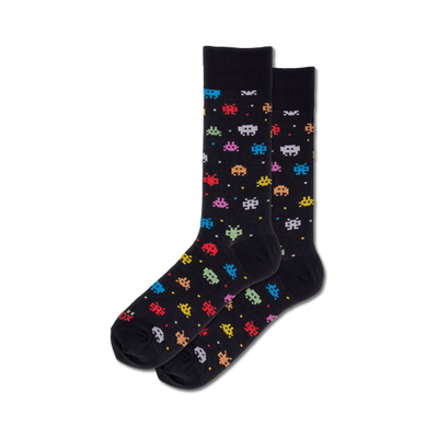 black crew socks featuring a colorful pattern of 8-bit alien robots.  