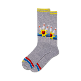 mens crew socks in gray feature red bowling balls and yellow bowling pins with blue starbursts and red, blue, and yellow stripes.  