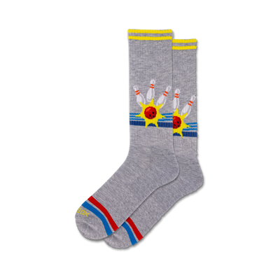 mens crew socks in gray feature red bowling balls and yellow bowling pins with blue starbursts and red, blue, and yellow stripes.  