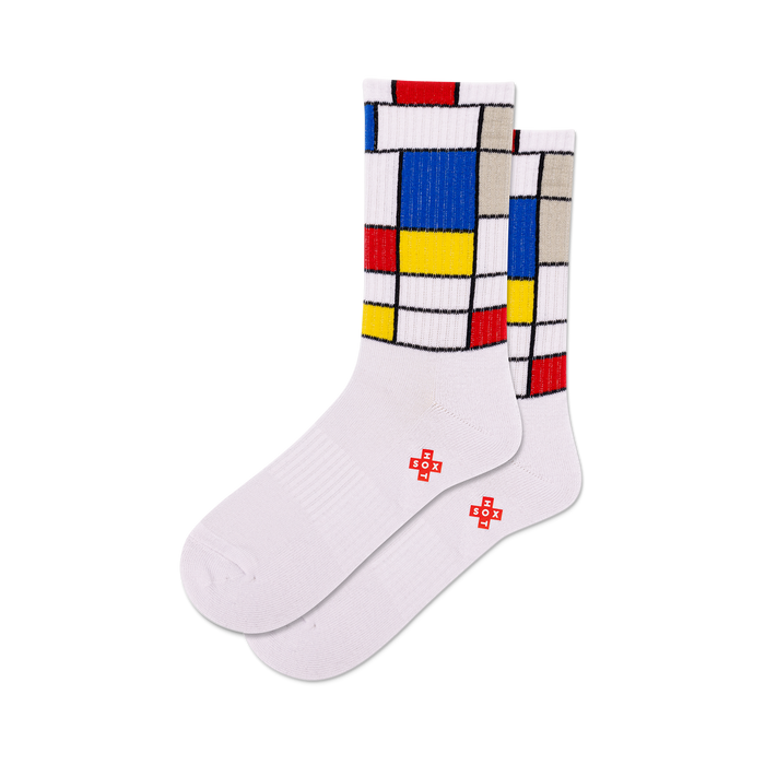 front view of a pair of white socks with red, yellow, blue, and grey mondrian-inspired squares.