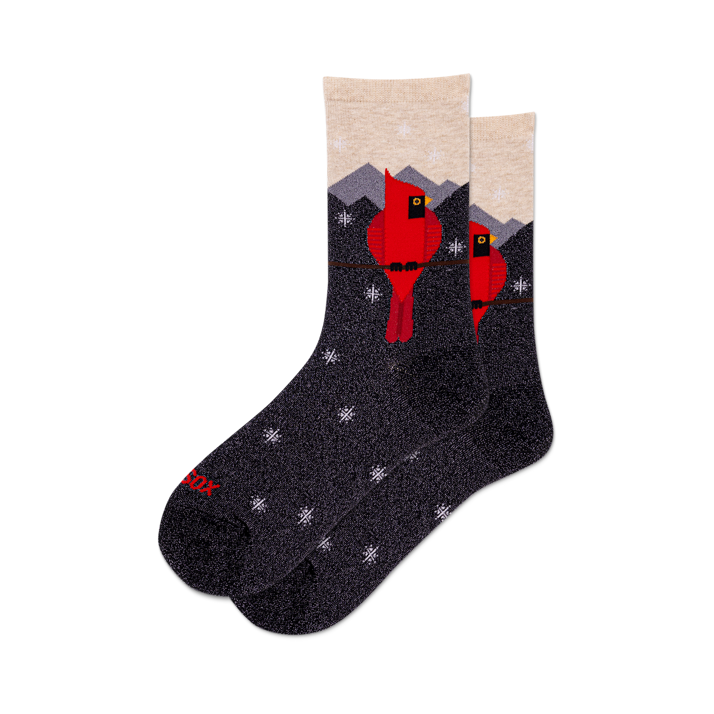 Pair of crew socks with a dark gray background.  Design features red cardinals perched on a branch against a snowy mountain scene with small snowflake details. Subtle metallic shimmer.