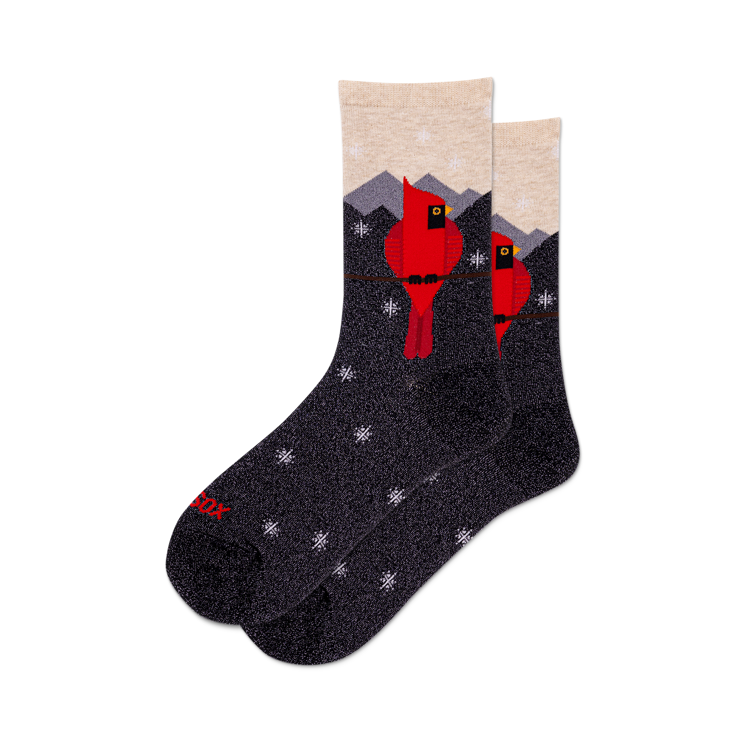 Pair of crew socks with a dark gray background.  Design features red cardinals perched on a branch against a snowy mountain scene with small snowflake details. Subtle metallic shimmer.