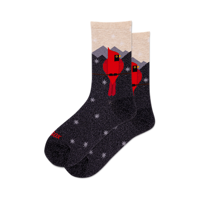 front view of two metallic grey crew socks with red cardinals and a winter mountain landscape.