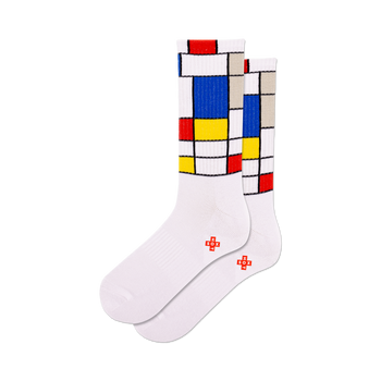 front view of a pair of white socks with a mondrian-inspired design in red, yellow, and blue.