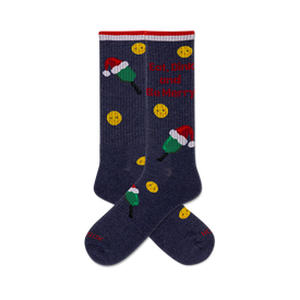 pair of blue crew socks with pickleball paddles wearing santa hats and the phrase "eat, dink and be merry."