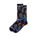 Pair of black crew socks with a whimsical design featuring abstract faces, floral elements, geometric shapes, and pops of blue and green.