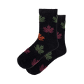 Pair of black fuzzy socks with colorful autumn leaf pattern. Crew-length socks in dark and muted colors.