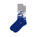 Crew socks with a solid dark blue foot, heather gray top, and a large crashing wave with a tiny surfer on an orange board.
