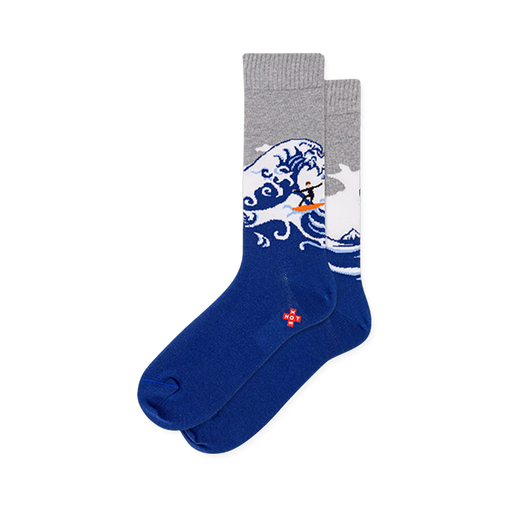Crew socks with a solid dark blue foot, heather gray top, and a large crashing wave with a tiny surfer on an orange board.