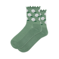 A pair of sage green crew socks with white dimpled golf balls and small green grass patches on the ankle, ribbed lower.