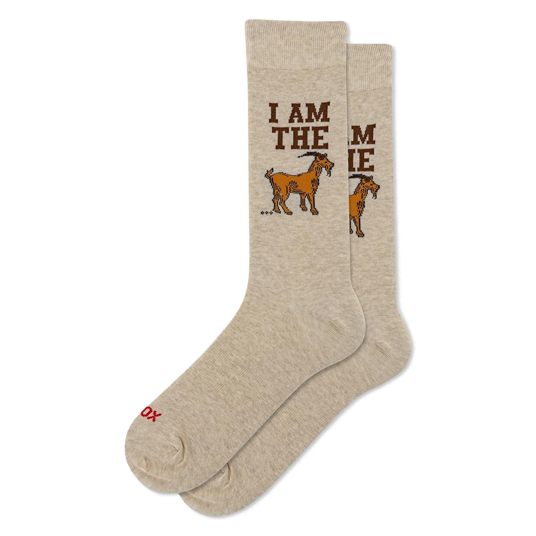 Light beige crew socks with "I AM THE GOAT" text. Each sock shows part of the phrase and a brown goat graphic.