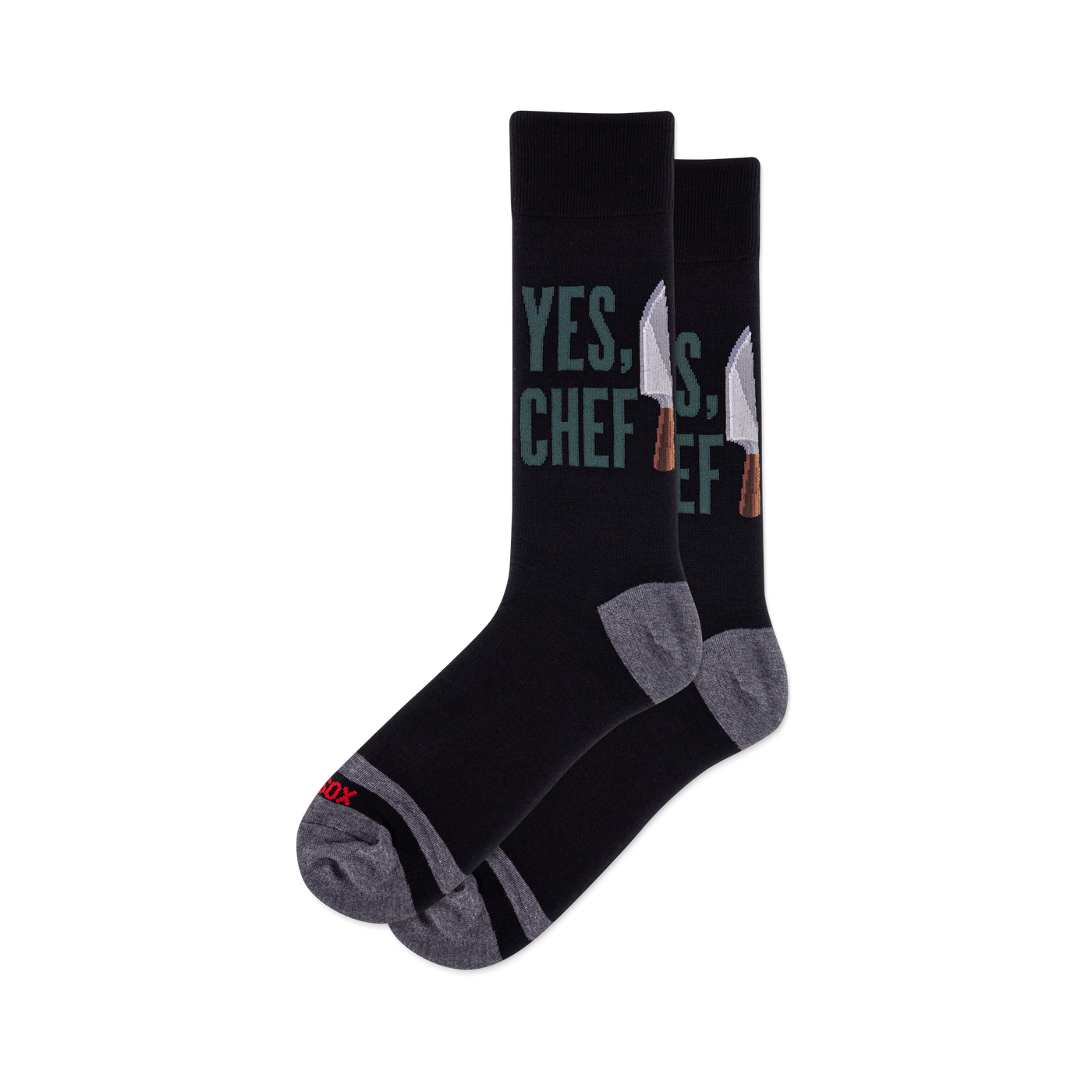 Pair of black crew socks featuring "YES, CHEF" in green text and silver chef knives. Grey heel, toe, and arch details.