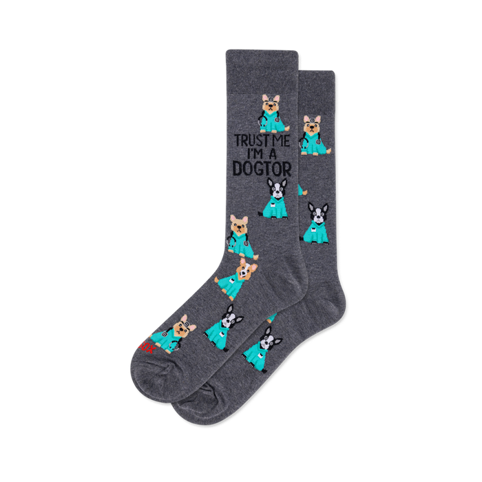 Dark grey crew socks with cartoon dogs in teal scrubs and stethoscopes. Text 'TRUST ME I'M A DOGTOR' on one sock. }}