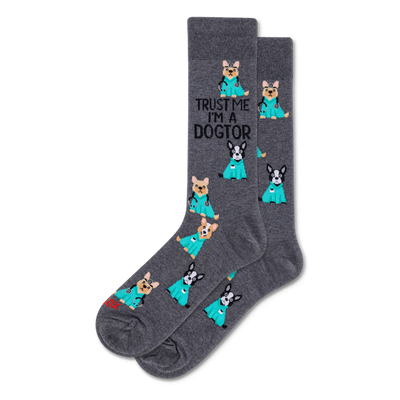 Dark grey crew socks with cartoon dogs in teal scrubs and stethoscopes. Text 'TRUST ME I'M A DOGTOR' on one sock.