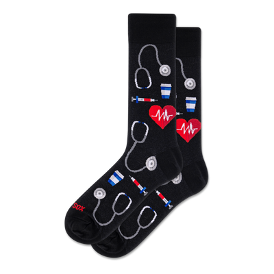 Pair of black crew socks with a repeating pattern of white outline stethoscopes, red EKG hearts, syringes, and coffee cups.