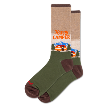 Crew socks with a tan upper, olive green lower, and brown accents. Design features "Happy Camper" text, orange camper, blue mountains, and green trees.