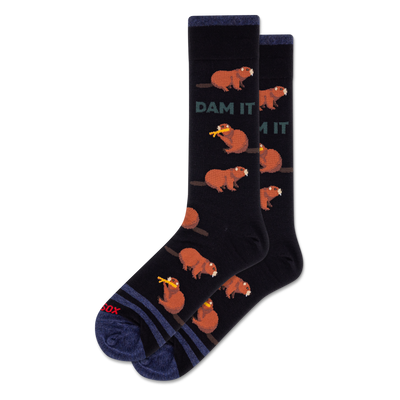 Pair of black crew socks with brown cartoon beavers, some holding yellow logs, and green "DAM IT" text.