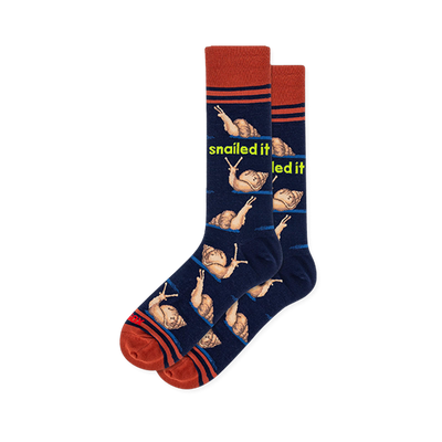 Navy crew socks with brown snails on blue trails, neon snailed it text, and rust orange striped cuffs and toes.