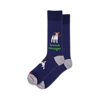 Pair of navy crew socks. One sock features a white and brown dog holding a stick with "branch manager" text in green. Grey heel and toe.