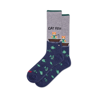 Crew socks with heather grey top, dark green cuff, and navy blue bottom. Design shows "CAT FISH" text, cats fishing from boats, and a pattern of green fish.