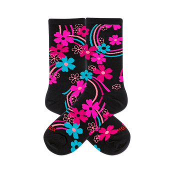 Pair of black crew socks with a vibrant rainbow floral pattern. Features hot pink, aqua, and outlined pink flowers and swirling lines.