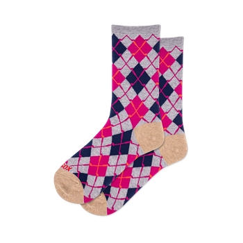 Pair of crew socks featuring a vibrant argyle pattern in navy blue, hot pink, light grey, and orange-red, with tan toes and heels.