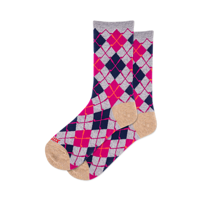 Pair of crew socks featuring a vibrant argyle pattern in navy blue, hot pink, light grey, and orange-red, with tan toes and heels.