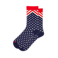 Navy blue crew socks covered in white stars, featuring a red and white chevron stripe pattern below a solid red cuff.