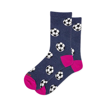 Heathered navy blue crew socks covered in black and white soccer balls with a bright hot pink heel and toe.