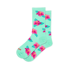 Mint green crew socks covered in a scattered pattern of bright pink hibiscus flowers with yellow centers and teal leaves.
