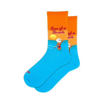 Bright blue and orange crew socks showing a woman in a pink bikini and white hat wading in the water below a setting sun.