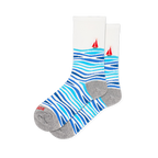 White crew socks featuring wavy light and dark blue stripes on the foot and a red sailboat on the calf, with a grey heel.