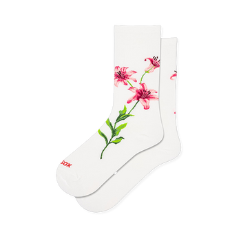 White crew socks featuring a large pink and red lily floral graphic with a long green stem stretching down the side.