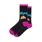 Black crew socks with blue Bonjour script above a croissant graphic, featuring hot pink accents on the heels and toes.