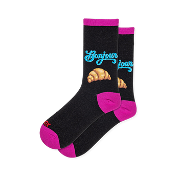 Black crew socks with blue Bonjour script above a croissant graphic, featuring hot pink accents on the heels and toes.